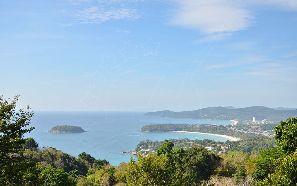 Panoramic hilltop view over turquoise bays, curved sandy beaches, forested headlands and a small offshore island
