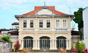 Sino-Portuguese colonial museum building with orange tiled roof and arched ground-floor entrances, Phuket Old Town
