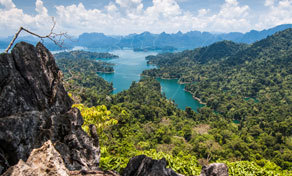 Panoramic viewpoint over turquoise reservoir with limestone karst islands and dense jungle, Khao Sok, Thailand