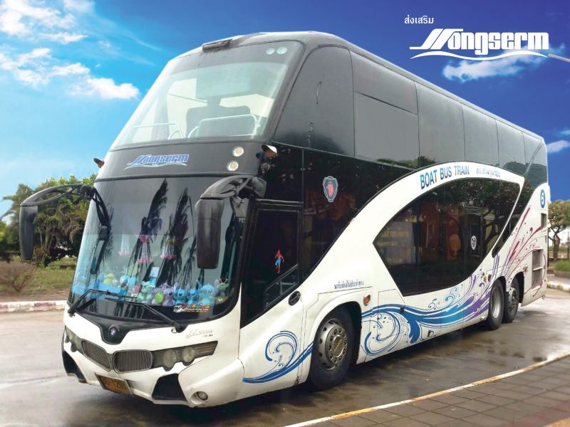 White double-deck Songserm coach with blue wave graphics and "Boat Bus Train" text parked on tarmac under blue sky
